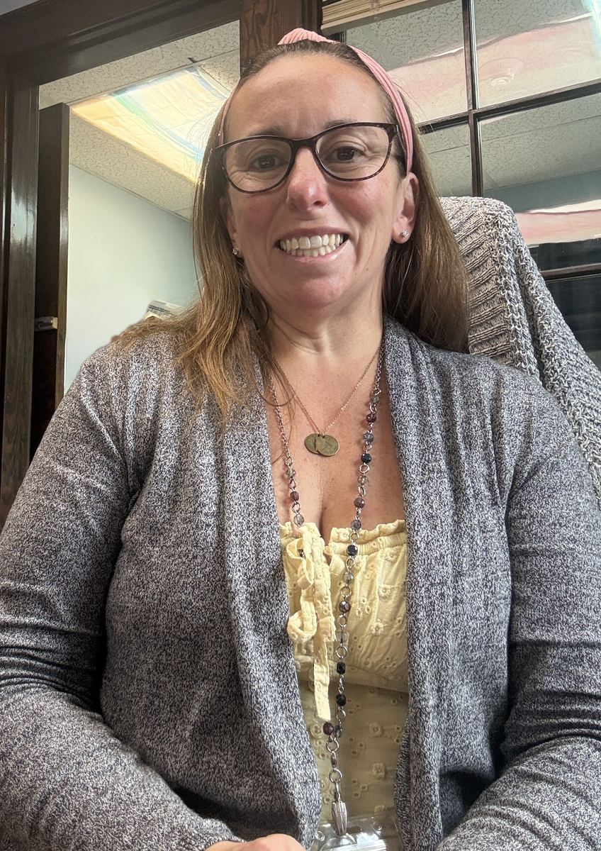 Shannon Bullard, Executive Director, smiling in her office